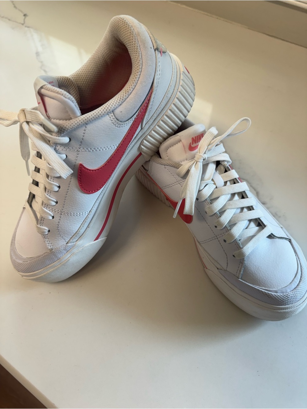 Nike White Sneakers with Pink Swoosh and Pink Heel Accent legacy’s
